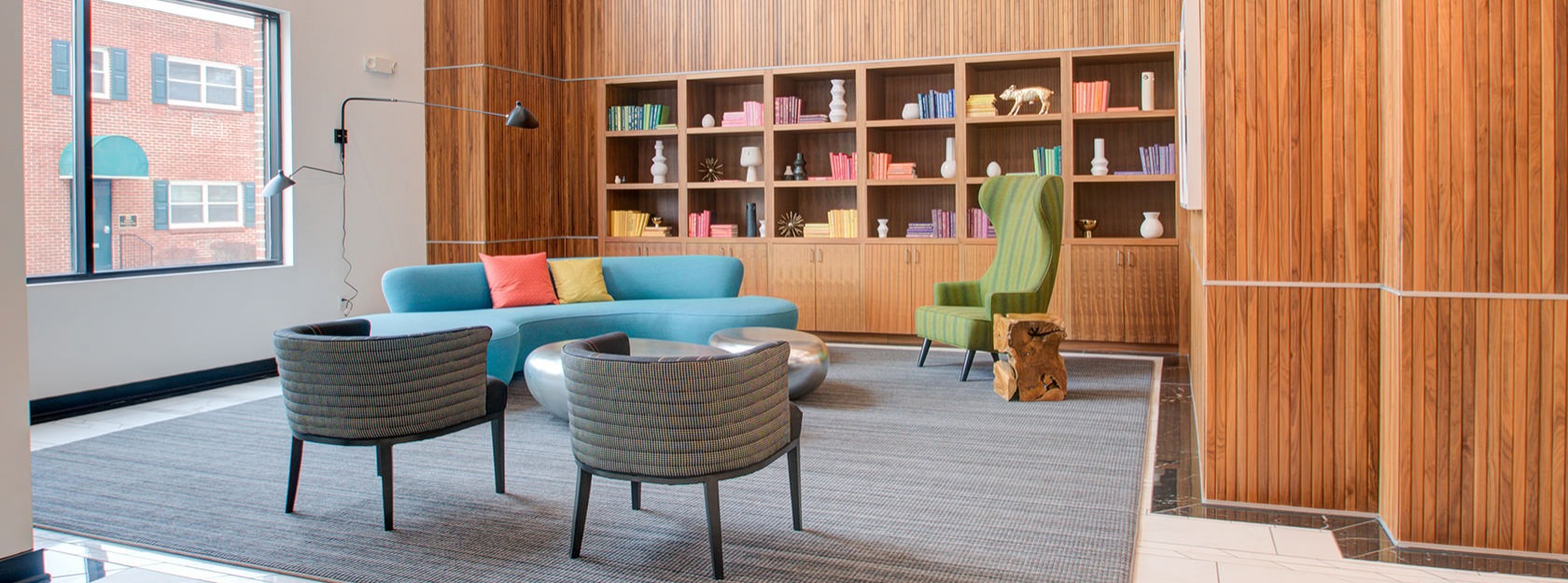 social area in lobby with bookshelves