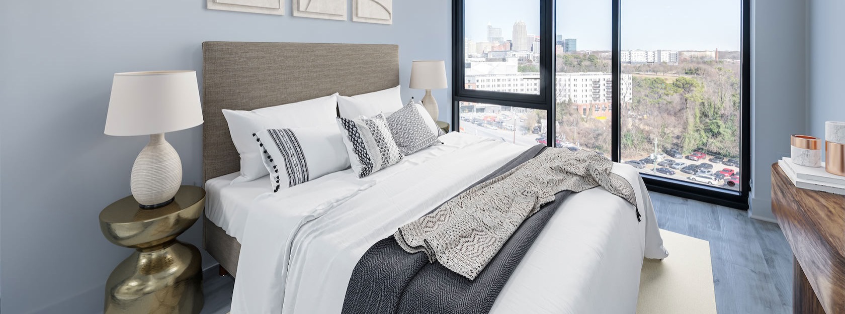 floor-to-ceiling windows with city views in bedroom