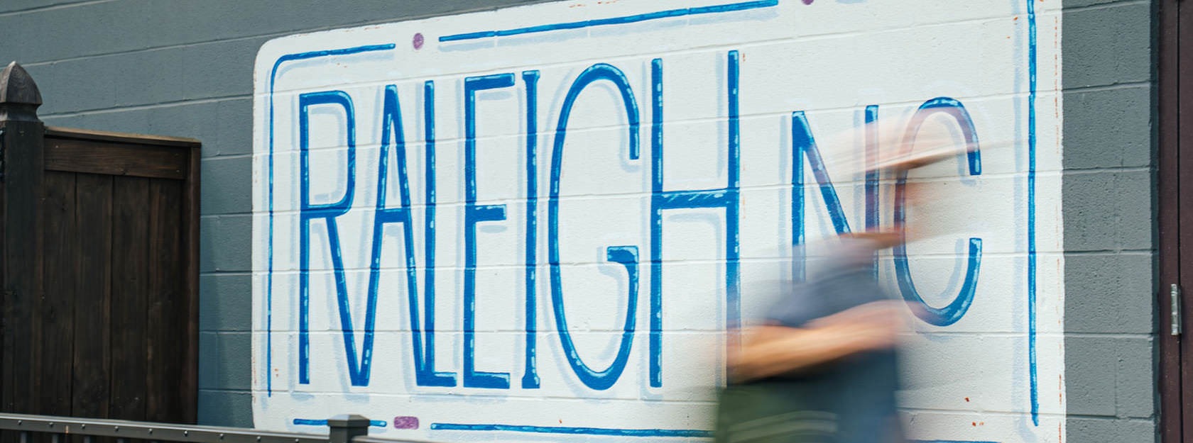 painted Raleigh, NC sign on a wall