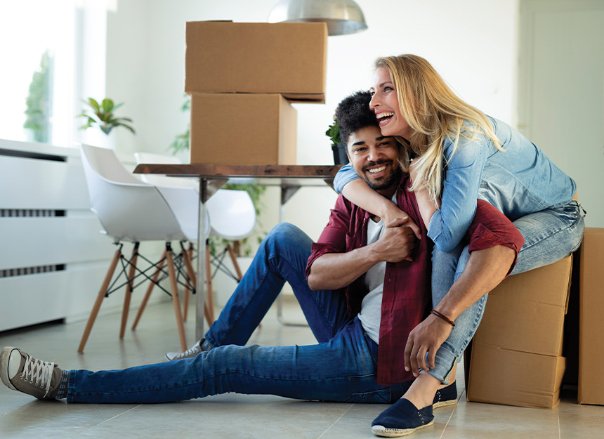 Couple sitting on moving boxes